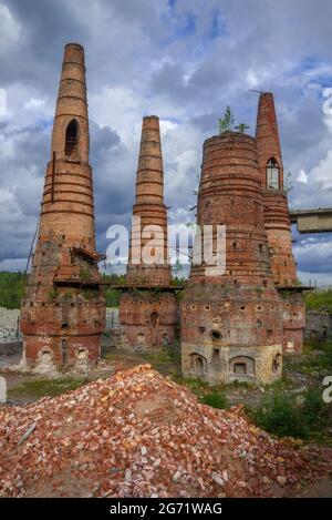 Ruins of lime kilns of an abandoned marble and lime factory close-up on a cloudy August day. Ruskeala, Karelia Stock Photo