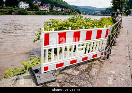 Heidelberg, Germany. 10th July, 2021. A barrier stands in front of an access to the banks of the Neckar. The water level is expected to rise above the navigation limit on Saturday. Credit: Uwe Anspach/dpa/Alamy Live News Stock Photo