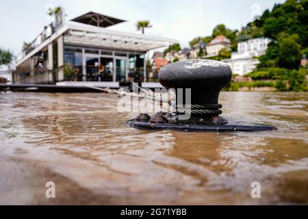 Heidelberg, Germany. 10th July, 2021. River water of the Neckar has flooded the post at a landing stage. The level is expected to rise above the navigation limit on Saturday. Credit: Uwe Anspach/dpa/Alamy Live News Stock Photo