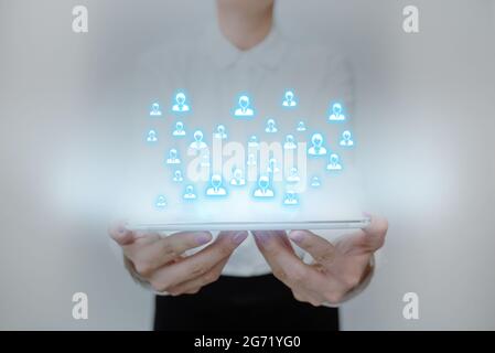 Lady In Uniform Standing Holding Tablet Presenting Late Tech Knowledge. Business Woman Carrying Pad Showing New Futuristic Technologies. Stock Photo
