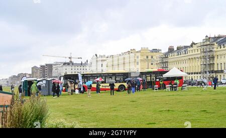 Brighton, UK. 10th July 2021. - A  Brighton & Hove bus being used as a mobile NHS COVID-19 Vaccination Centre on Hove Lawns today . There has been a steep rise in positive COVID-19 cases in the city over the last 2 weeks : Credit Simon Dack / Alamy Live News Stock Photo