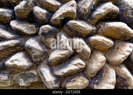 Texture of an old wall with different size stones - detail of an old wall Stock Photo