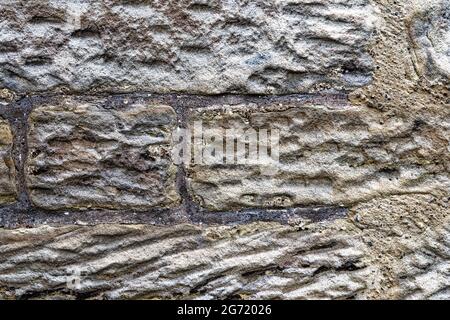 Texture of an old wall with different size stones - detail of an old wall Stock Photo