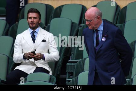 London, UK. 07th July, 2021. London Wimbledon Championships Day 11 09/07/2021 David Beckham and the Chairman of the All England Club in the Royal Box Credit: Roger Parker/Alamy Live News Stock Photo