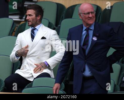 London, UK. 07th July, 2021. London Wimbledon Championships Day 11 09/07/2021 David Beckham and the Chairman of the All England Club in the Royal Box Credit: Roger Parker/Alamy Live News Stock Photo