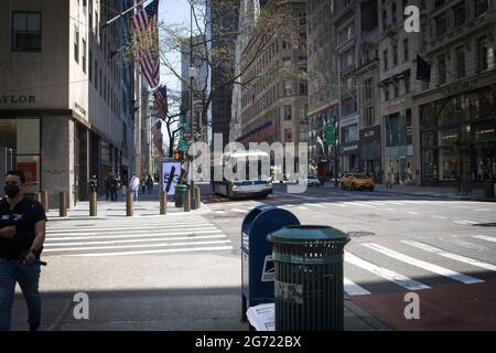 New York, NY, USA - July 10, 2021: A city bus with a MASKS REQUIRED sign showing on the front of the bus Stock Photo