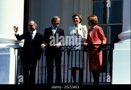 United States President Jimmy Carter, left center, and King Hussein I of Jordan, left, appear on the Blue Room Balcony at the conclusion of the State Arrival ceremony on the South Lawn of the White House in Washington, DC on 17 June, 1980. At center right is Queen Queen Noor al-Hussein of Jordan and at right is first lady Rosalynn CarterCredit: Benjamin E. 'Gene' Forte/CNP Photo via Credit: Newscom/Alamy Live News