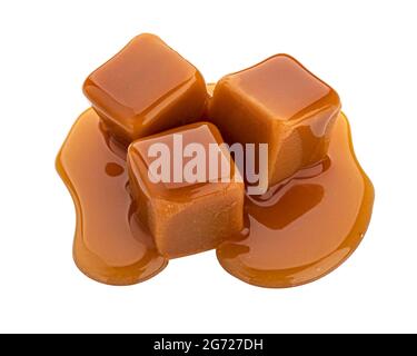 Caramel candy and caramel sauce isolated on white background Stock Photo