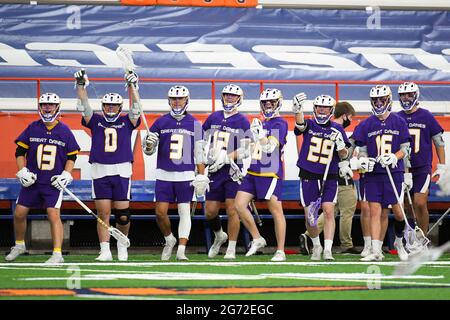 Syracuse, New York, USA. 08th Apr, 2021. Albany Great Danes players celebrate from the sidelines against the Syracuse Orange during the first half of an NCAA mens lacrosse game on Thursday, April 8, 2021 at the Carrier Dome in Syracuse, New York. Syracuse won 13-8. Rich Barnes/CSM/Alamy Live News Stock Photo