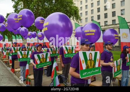 London, UK. 10th July 2021. Protesters hold pictures of Maryam Rajavi outside Downing Street during the Free Iran World Summit. (Credit: Vuk Valcic / Alamy Live News)