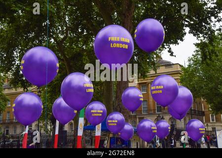 London, UK. 10th July 2021. FRee Iran London balloons outside Downing Street during the Free Iran World Summit and protest. (Credit: Vuk Valcic / Alamy Live News)