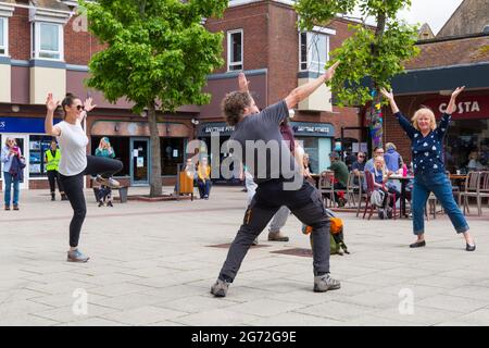 Christchurch, Dorset UK. 10th July 2021. Folk Dance Remixed get the crowds up dancing, whether in a bubble or flying solo, at Christchurch, Dorset, as part of the Arts by the Sea Summer Series. Credit: Carolyn Jenkins/Alamy Live News Stock Photo