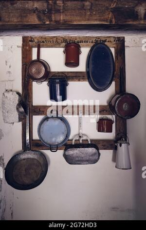 Very old frying pans, saucepans, pots and kitchen tools, Marquèze, France Stock Photo