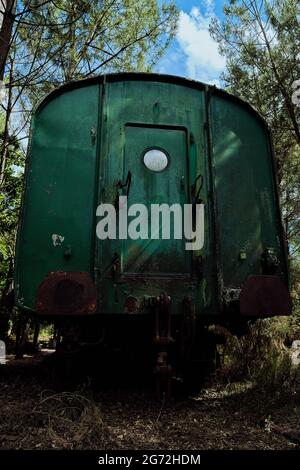 Old abandoned train wreck in a forest, Eco museum of Marquèze, France Stock Photo