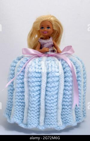 Toilet Doll, a Barbie doll with crochet dress over a toliet roll Stock Photo