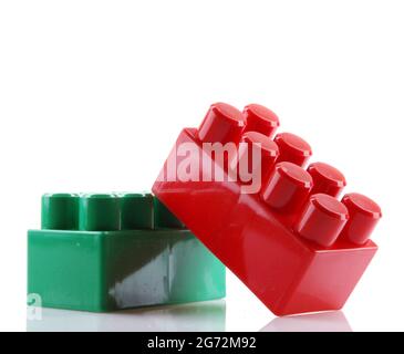 Closeup of red and green toy bricks isolated on white background Stock Photo