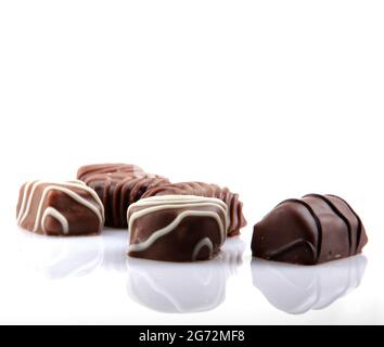 Closeup of sweet chocolate bonbons isolated on white background Stock Photo