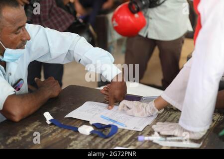 Dhaka, Dhaka, Bangladesh. 10th July, 2021. 10, July, 2021 Relatives of victims give blood for DNA matching with undefined dead bodies following a fire in Rupgonj, Narayangonj Credit: Harun-Or-Rashid/ZUMA Wire/Alamy Live News Stock Photo