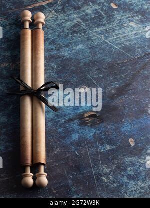 Closed Antique Scroll on a Rustic Blue Wooden Table Stock Photo