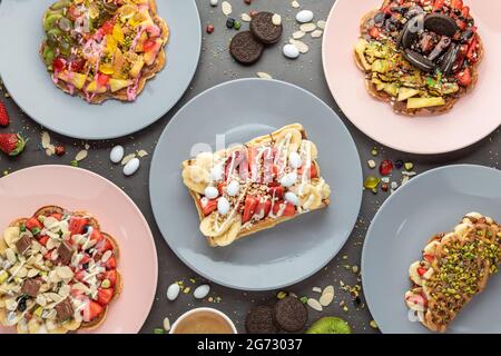 Three different waffles in square, heart and bubble shape. Stock Photo