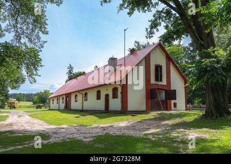 Stable in horse breeding in Florianka, Zwierzyniec, Roztocze, Poland. Agriculture building in idyllic rural scenery on a sunny day. Stock Photo