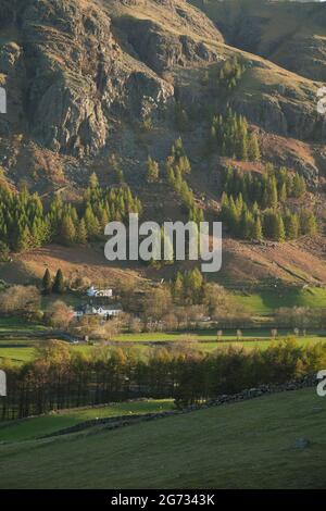 Old Dungeon Ghyll Hotel in Great Langdale from the slopes of Side Pike, taken at dawn in the Lake District National Park. Stock Photo