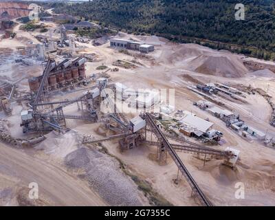 Quarry stone. Mining and processing plant, mineral piles and sand Industrial building. Stock Photo