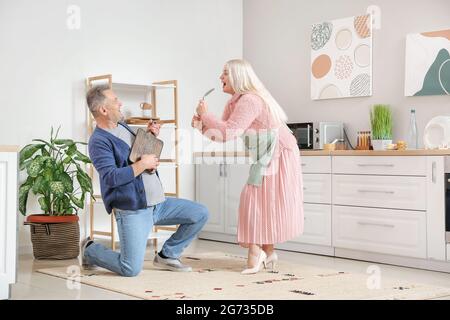 Happy mature couple dancing at home Stock Photo