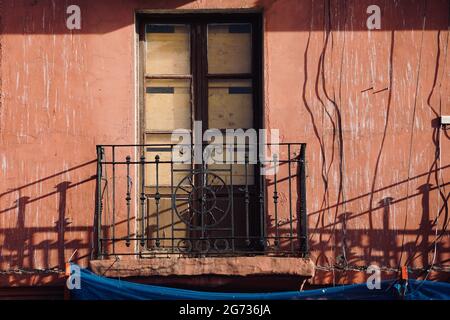 Old balcony on the facade of the house in Bilbao city, Spain Stock Photo