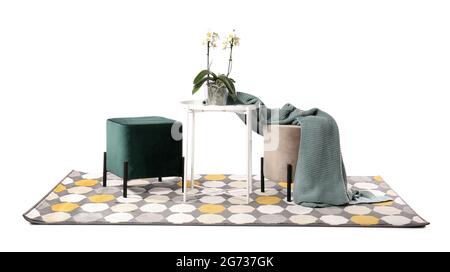 Stylish poufs with table and rug on white background Stock Photo