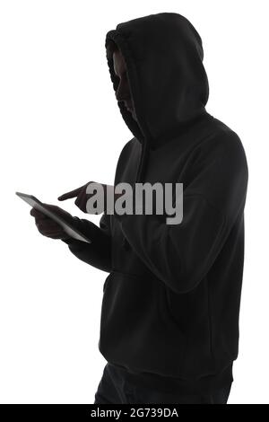 Silhouette of hacker with tablet computer on white background Stock Photo