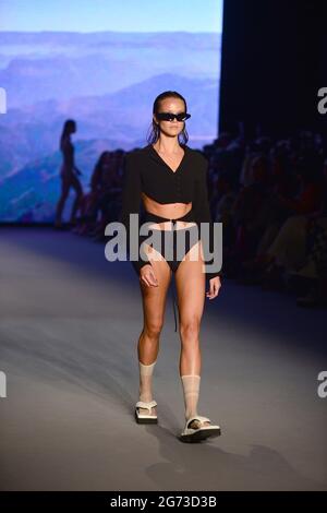 Miami Beach, USA. 09th July, 2021. MIAMI BEACH, FLORIDA - JULY 9: A model walks the runway during The Simonett - Futural Resist FW21 fashion show at PARAISO Tent on July 9, 2021 in Miami Beach, Florida. (Photo by JL/Sipa USA) Credit: Sipa USA/Alamy Live News Stock Photo