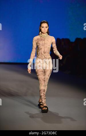 Miami Beach, USA. 09th July, 2021. MIAMI BEACH, FLORIDA - JULY 9: A model walks the runway during The Simonett - Futural Resist FW21 fashion show at PARAISO Tent on July 9, 2021 in Miami Beach, Florida. (Photo by JL/Sipa USA) Credit: Sipa USA/Alamy Live News Stock Photo