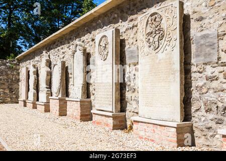 17th century evangelical tombstones on display in garden of Lenck-villa, Sopron, Hungary Stock Photo