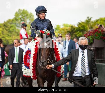 Elmont, New York, USA. 10th July, 2021. July 10, 2021: Bolshoi Ballet (IRE), ridden by Ryan Moore, wins the 2021 running of the G1 Belmont Derby at Belmont Park in Elmont, NY. Sophie Shore/ESW/CSM/Alamy Live News Stock Photo