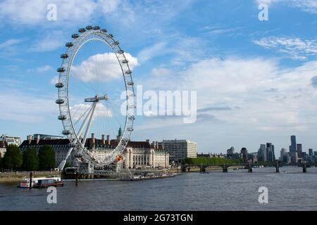 The London Eye, County Hall and Westminster Bridge viewed from the Golden Jubilee Bridge over the River Thames, London, UK Stock Photo