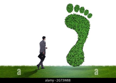 Ecology concept with the green footprint and businessman Stock Photo