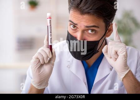 Young biochemist testing blood samples Stock Photo