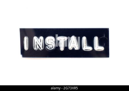 Embossed letter in word install on black banner with white background Stock Photo