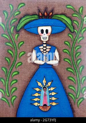 Day of the Dead image; photographic illustration; a skeleton woman in a blue dress, standing between two ferns Stock Photo