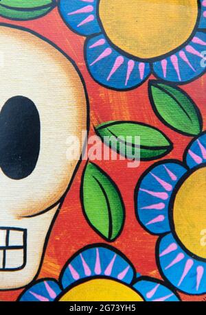 Day of the Dead image; photographic illustration; half a skeleton skull surrounded by flowers. Stock Photo