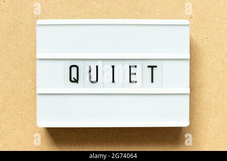 Lightbox with word quiet on wood background Stock Photo