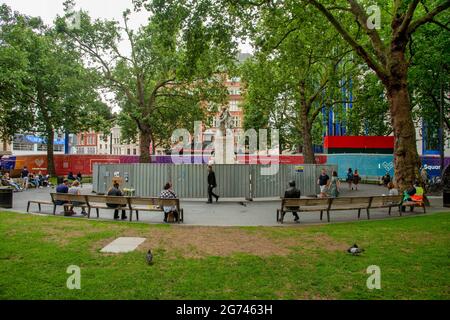 London, UK. 10th July, 2021. The Shakespeare Water Fountain in Leicester Square, central London boarded up during the UEFA Euro 2020 championships as Football fans have in the past climbed on to the statue to celebrate teams victories and risk either injuring themselves or damaging the fountain. Credit: SOPA Images Limited/Alamy Live News Stock Photo