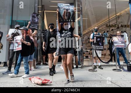 Animal rights activists protest outside designer store Yves Saint Laurent in New York City on July 10, 2021. The activists call on the luxury label to join Canada Goose and Saks Fifth Avenue, which recently announced that they would phase out the sale of fur products in their stores. (Photo by Gabriele Holtermann/Sipa USA) Credit: Sipa USA/Alamy Live News Stock Photo