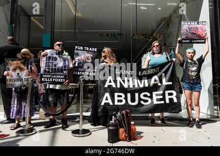 Animal rights activists protest outside designer store Yves Saint Laurent in New York City on July 10, 2021. The activists call on the luxury label to join Canada Goose and Saks Fifth Avenue, which recently announced that they would phase out the sale of fur products in their stores. (Photo by Gabriele Holtermann/Sipa USA) Credit: Sipa USA/Alamy Live News Stock Photo