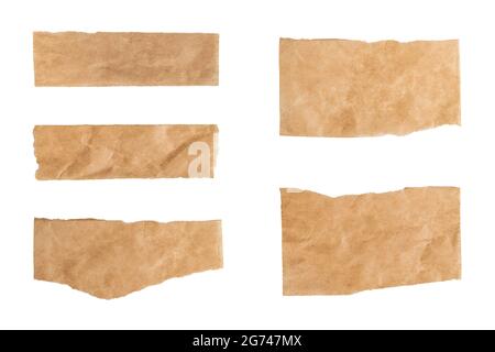 Close up of a ripped piece set of brown paper on white background Stock Photo