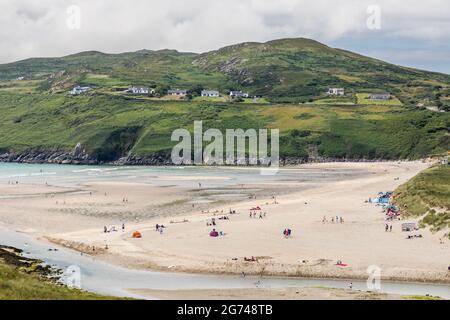 Barleycove, Cork, Ireland. 10th July, 2021. On a warm summers day holidaymakers spend the day at the beach in Barleycove, Co. Cork, Ireland. - Picture; David Creedon Stock Photo