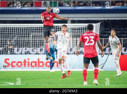 Jul 10, 2021: Trinidad and Tobago midfielder Reon Moore (13) jumps up for the ball in the first half during a CONCACAF Gold Cup game between Mexico and Trinidad & Tobago at AT&T Stadium in Arlington, TX Mexico and Trinidad & Tobago tied 0-0 Albert Pena/CSM Stock Photo