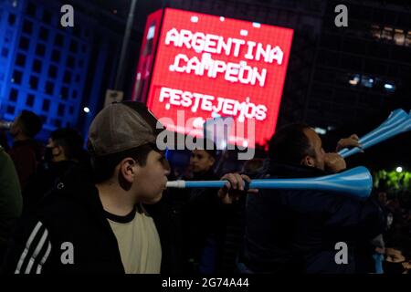 City of Buenos Aires, City of Buenos Aires, Argentina. 10th July, 2021. INT. SportsNews. July 10, 2021. City of Buenos Aires, Argentina.- Argentina fans celebrate winning the Copa America final soccer match against Brazil, in Buenos Aires, Argentina, July 10, 2021. Credit: Julieta Ferrario/ZUMA Wire/Alamy Live News Stock Photo