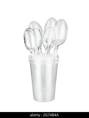 Plastic spoons, plastic cups stack white background isolated closeup transparent plastic drinking glasses for water, coffee, tea, disposable tableware Stock Photo